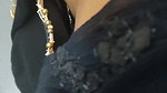 Desi woman bare back and black bra visible from top