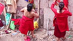 Multiple women wearing clothes after bath at ghat