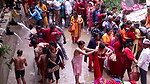 Multiple women wearing clothes after bath at ghat