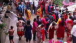 Multiple women wearing clothes after bath at ghat