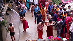 Multiple women wearing clothes after bath at ghat