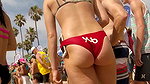 Plump round ass closeup caught by voyeur on beach (HD)