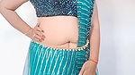 kruti Patel with net saree drapping with waist cha.