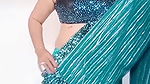 kruti Patel with net saree drapping with waist cha.