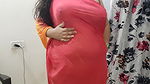horny desi Indian bhabhi trying on her new clothes in her bedroom.
