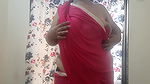 HOT DESI BHABHI IN RED TRNASPARENT SAREE.