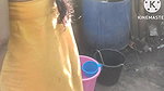 Anita yadav bathing outside with hot.
