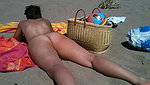 In her exclusive scene Nikki Sun mounts a trio with DP on the beach_320ffa86
