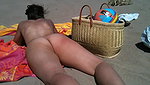 In her exclusive scene Nikki Sun mounts a trio with DP on the beach_320ffa86