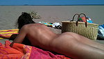 In her exclusive scene Nikki Sun mounts a trio with DP on the beach_320ffa86
