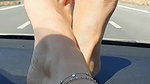 Feet on dashboard.