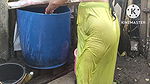 indian housewife bathing outside with dance