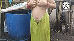 indian housewife bathing outside with dance