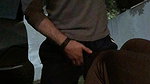 A girl in nature punishes a guy in the balls