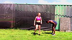 A guy gets hit in the groin while training with a girl