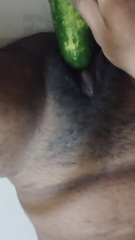 Busty bitch playing with herself and fucking herself with a cucumber