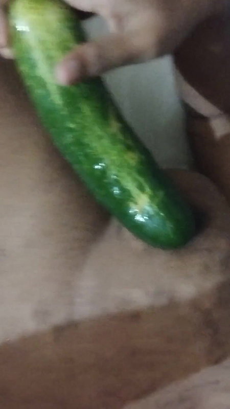 Busty bitch playing with herself and fucking herself with a cucumber