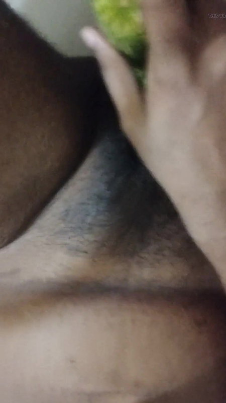 Busty bitch playing with herself and fucking herself with a cucumber