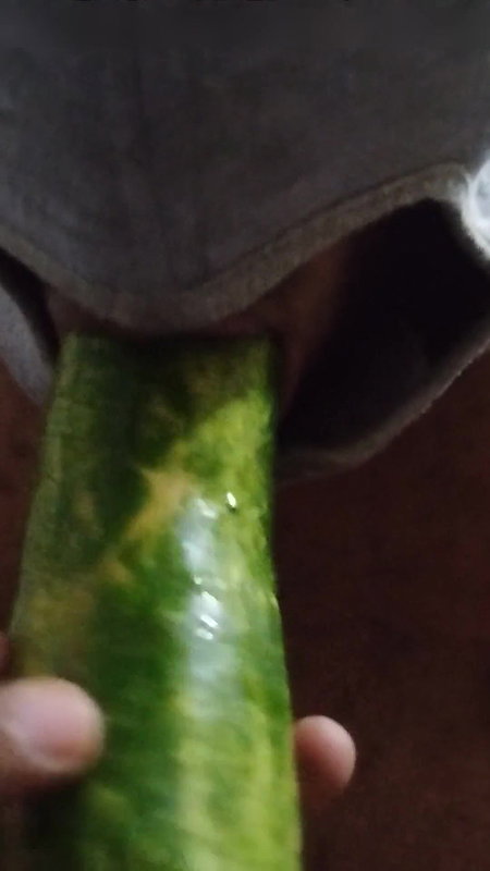 Busty bitch playing with herself and fucking herself with a cucumber